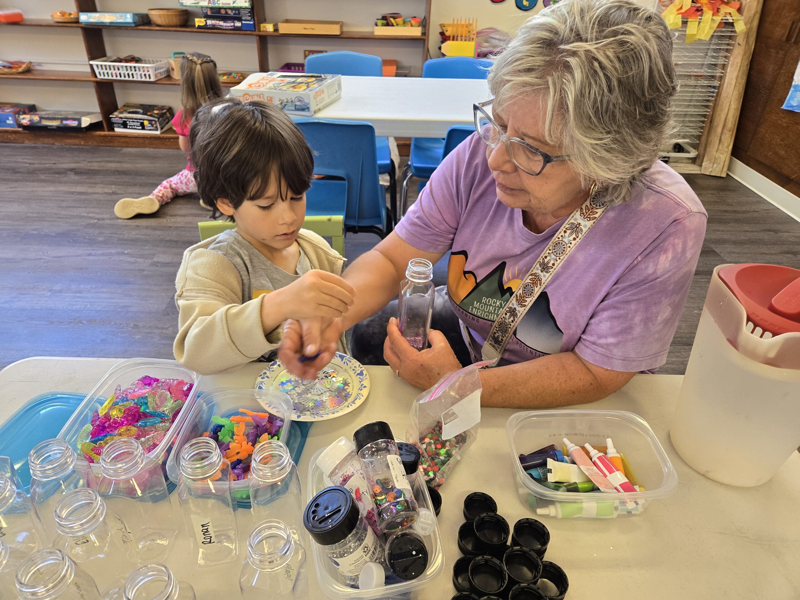 teacher engaging with young child